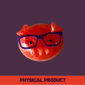 a red pig shaped object with glasses magnet, physical product